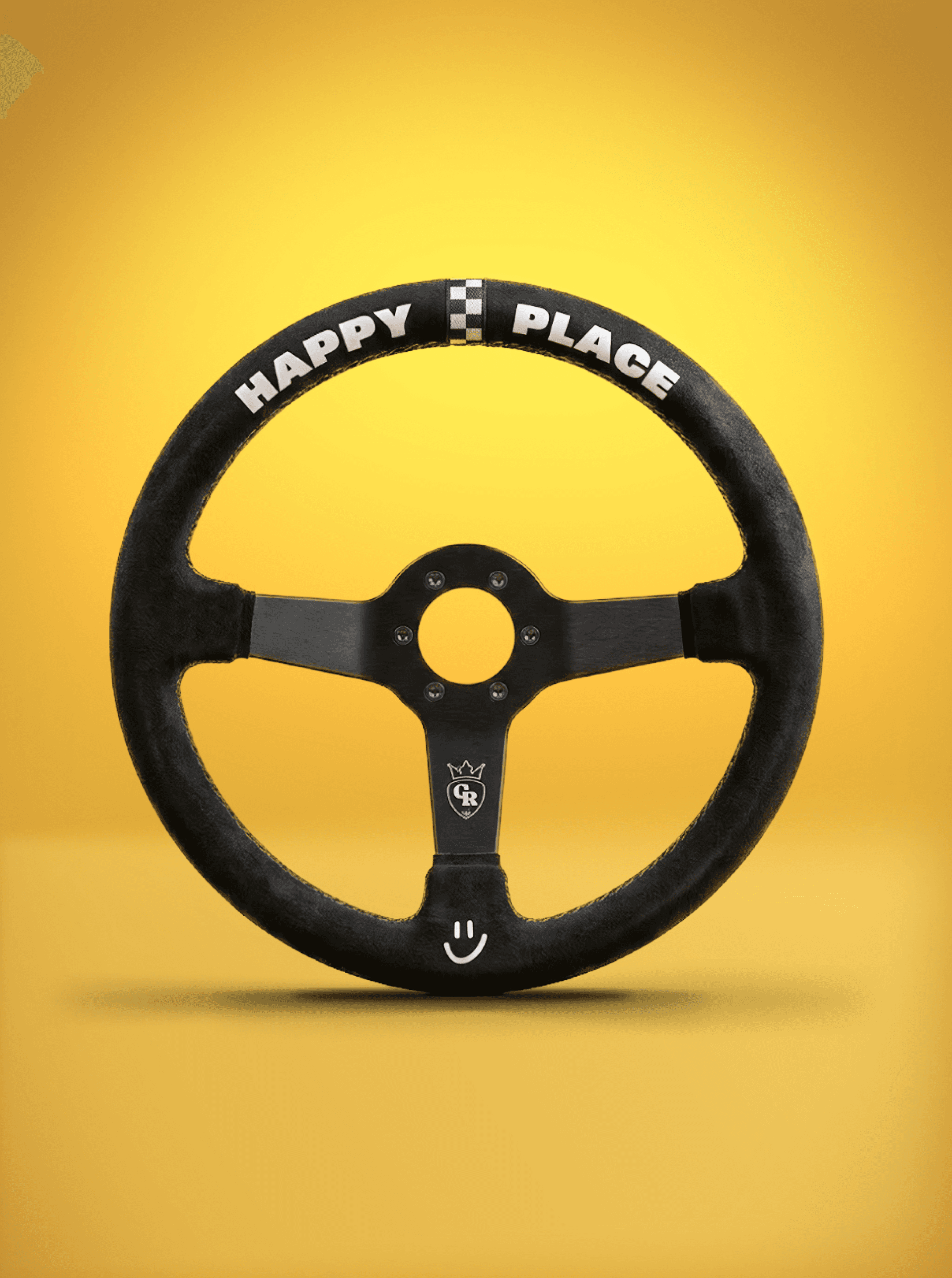 Black suede steering wheel on yellow, its rim printed "HAPPY PLACE" beside a checkered square and a GR crown
